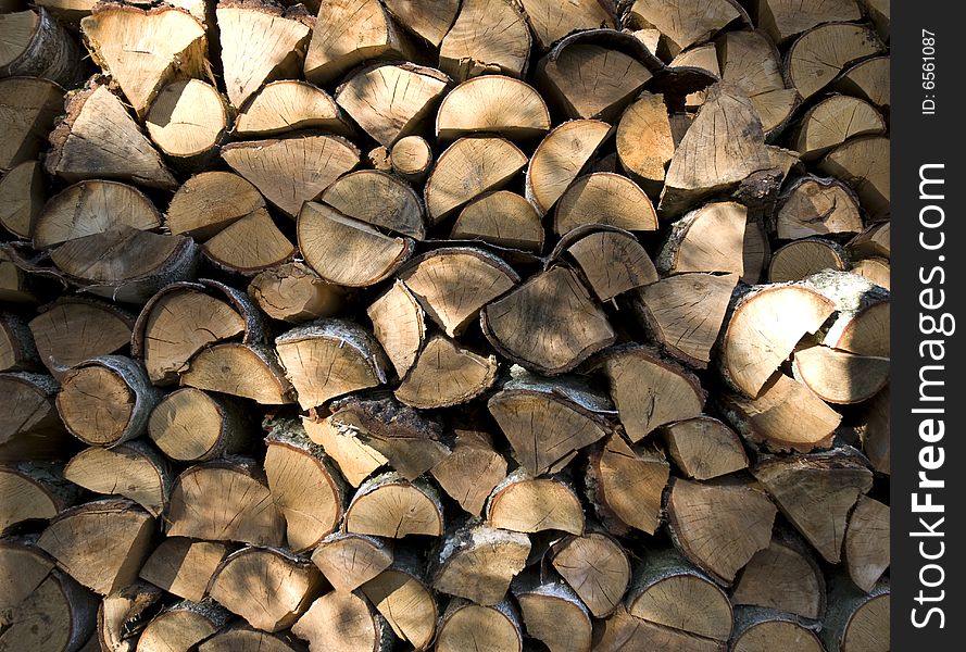 Chopped chunks of wood glowing in late afternoon sun. Chopped chunks of wood glowing in late afternoon sun.