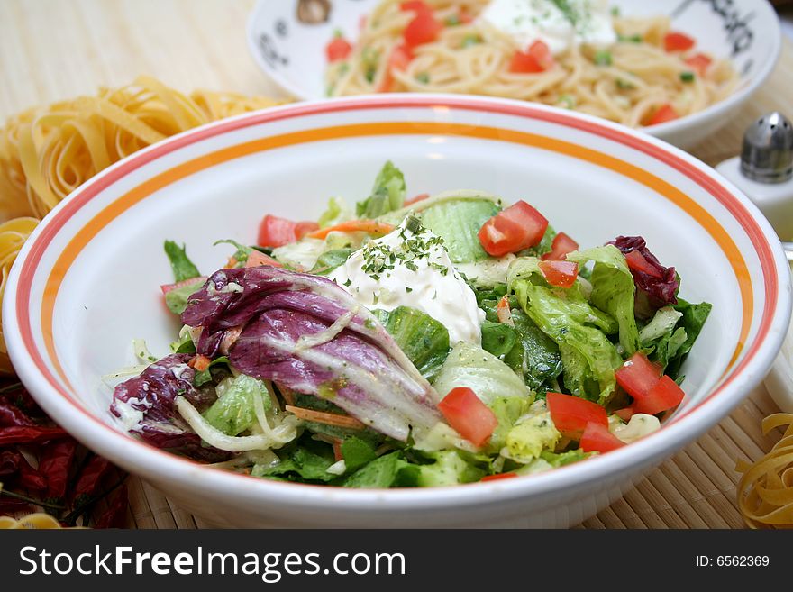 A fresh mixed salad with oil and spices