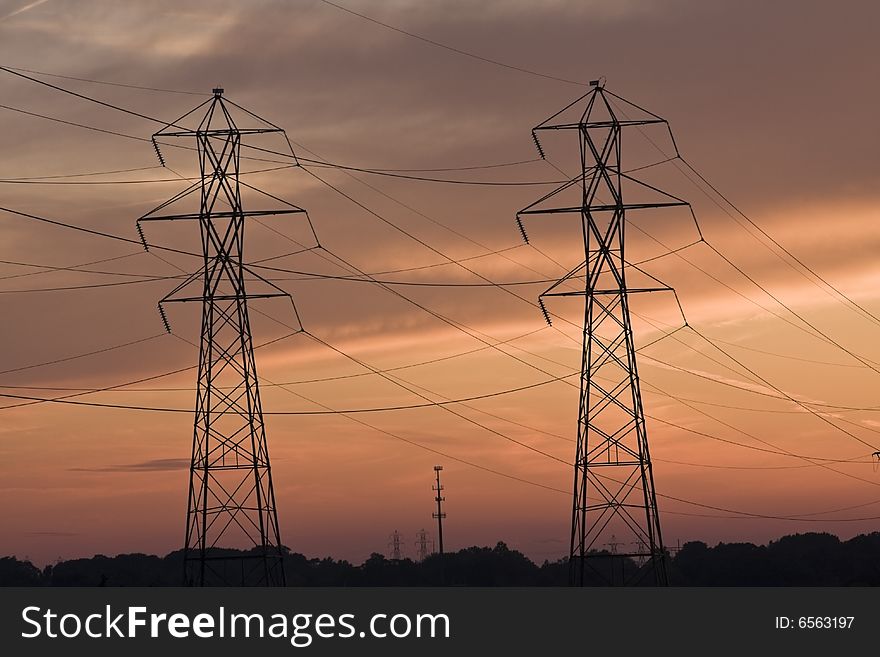 Power lines and Cell Tower at sunset