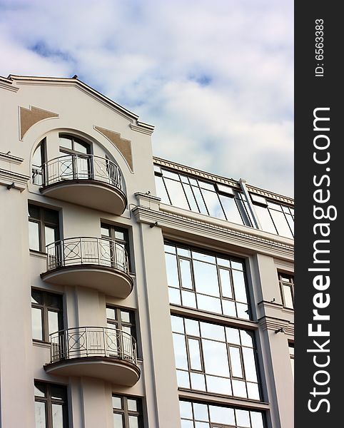 Modern a vein the house on a background of the clouds sky. Modern a vein the house on a background of the clouds sky