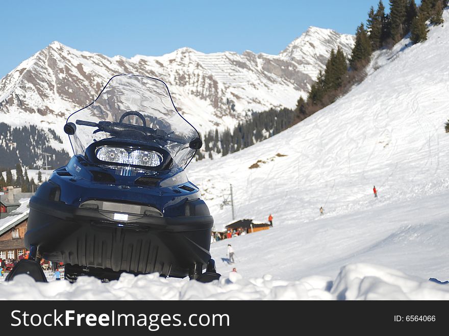 The snow mobile in the swiss Alpes. The snow mobile in the swiss Alpes