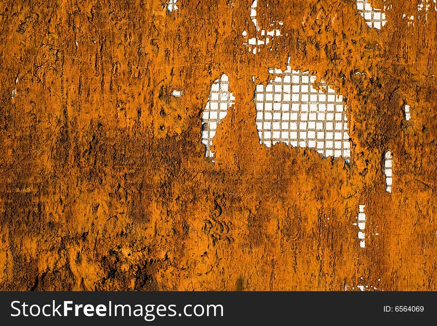 Rusty wall with mosaic pattern