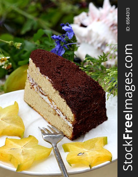 Piece of chocolat cake with starfruit. Piece of chocolat cake with starfruit