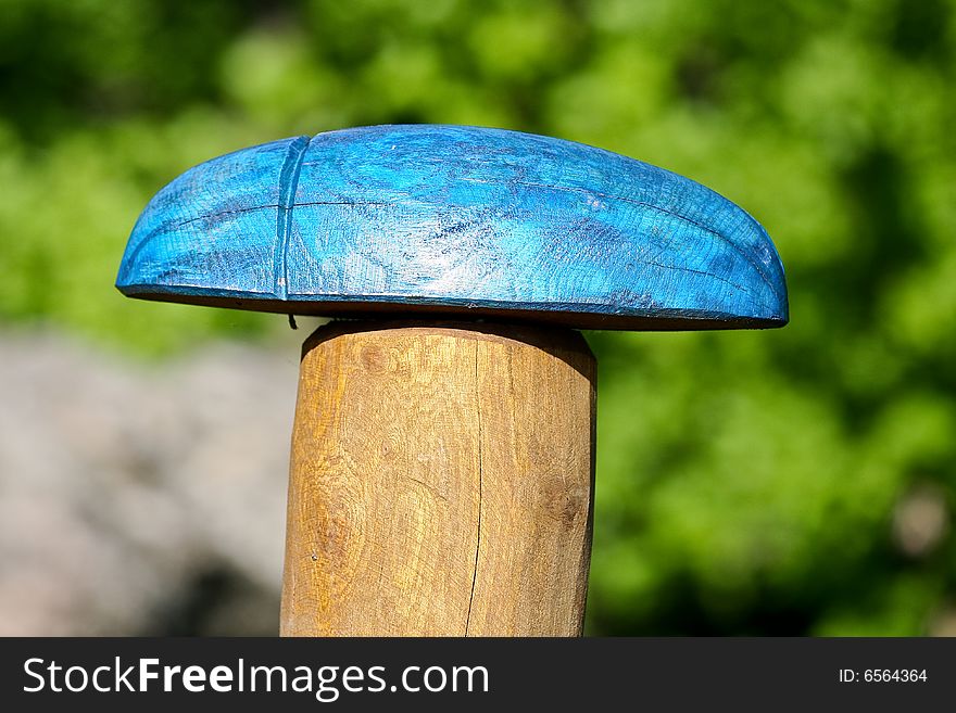 Blue wooden scarab beetle as a tourist sign