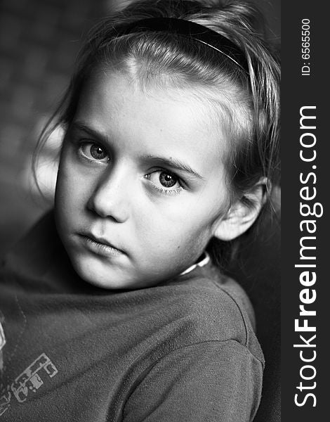 Portrait of boy in black and white with big eyes.