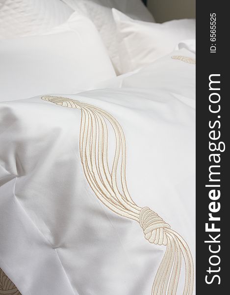 An image of luxurious upscale bedding and linens. An image of luxurious upscale bedding and linens