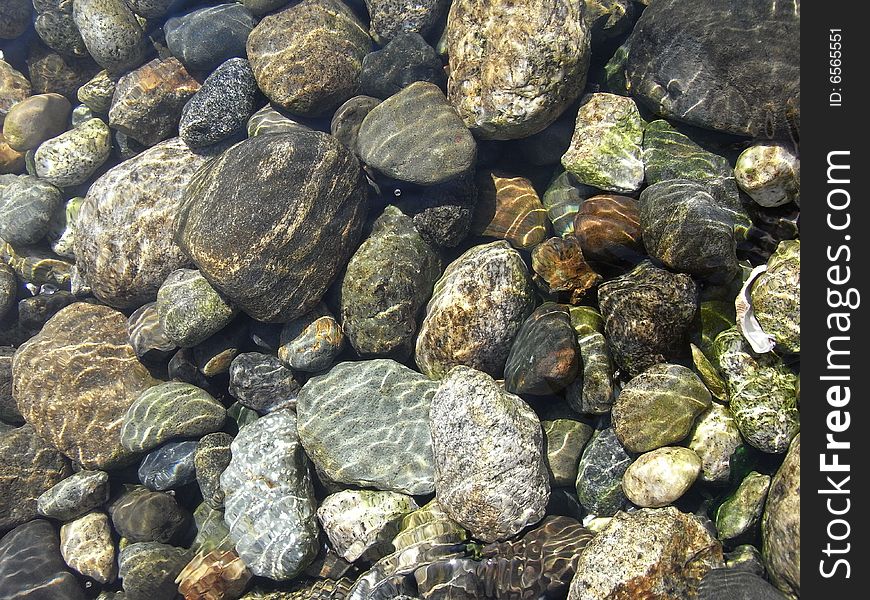 Many stones directly below the water line. Many stones directly below the water line