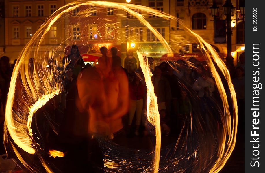 Street artists performing magic at night. Street artists performing magic at night