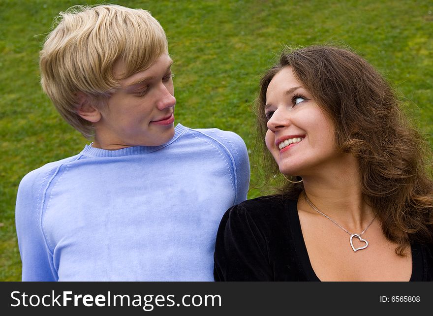 Close up of a smiling young couple in love. outdoor