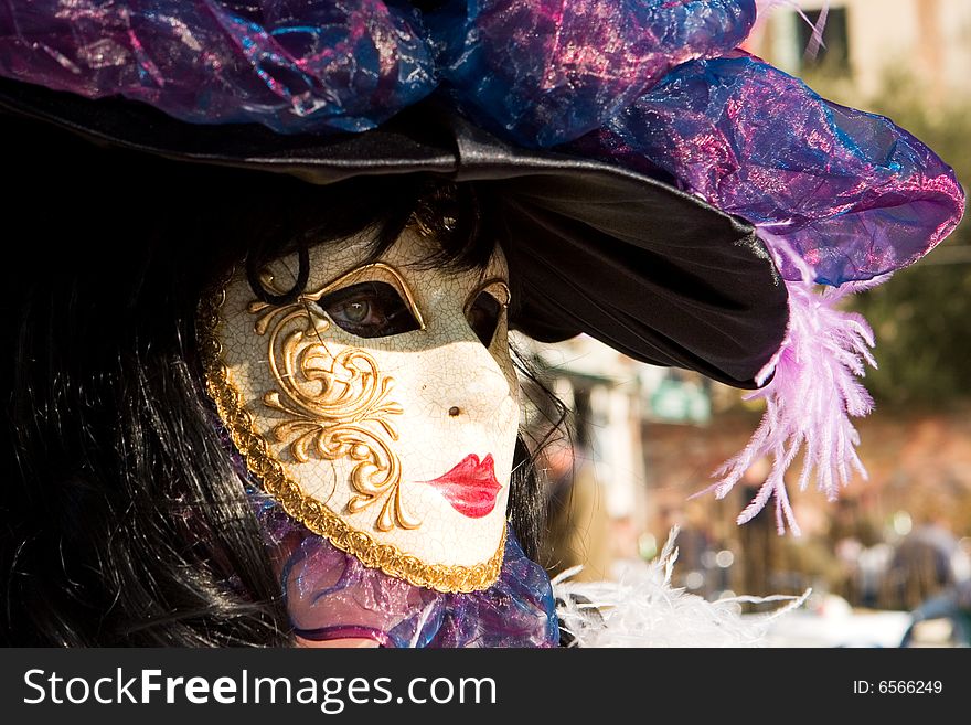 A Woman In Costume At The Venice Carnival