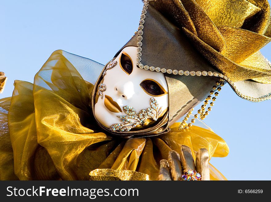 A venetian woman in a gold costume