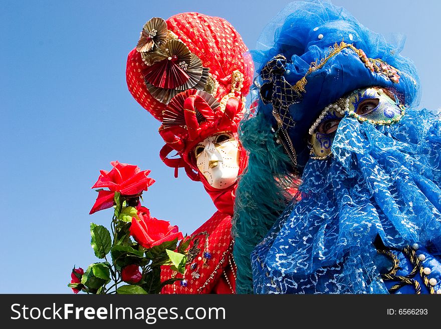 Two people in costume at the Venice Carnival