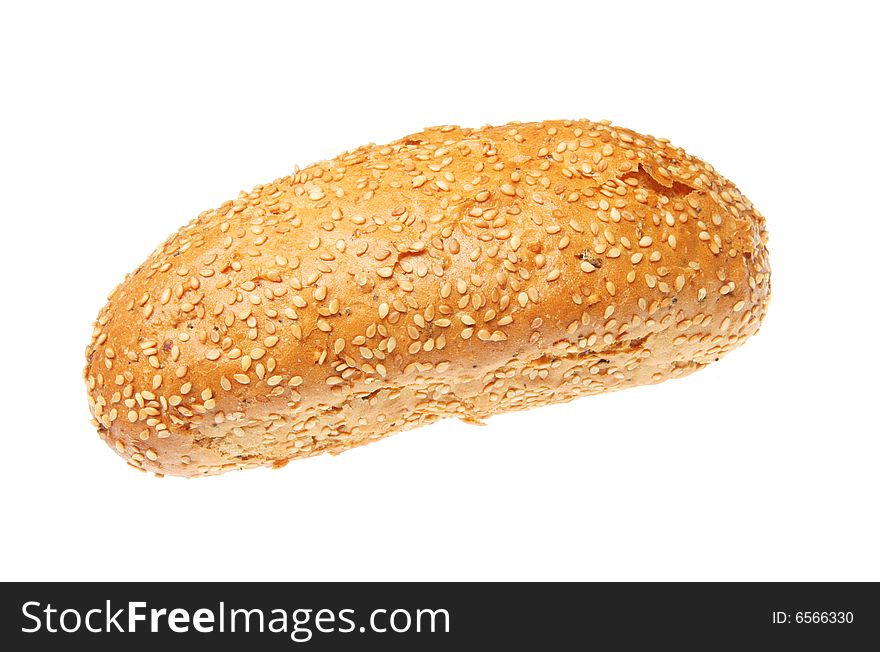 Sesame seeded torpedo bread roll isolated on white. Sesame seeded torpedo bread roll isolated on white