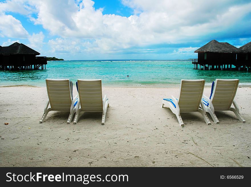 Canvas chairs on an maldivian island seashore. Canvas chairs on an maldivian island seashore