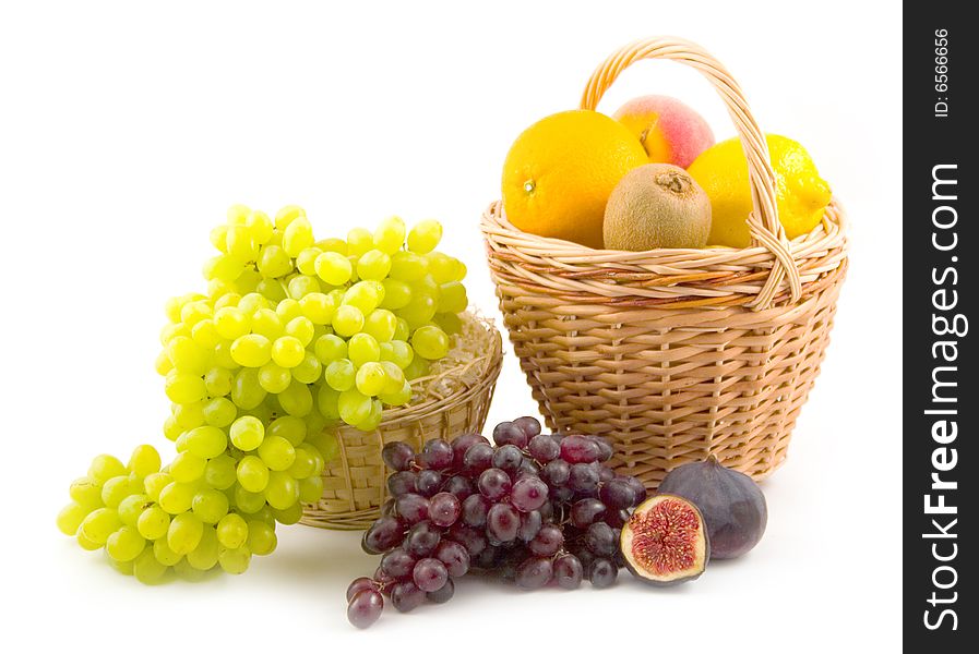 Many different and tasty fruit grapes fig peach lemon on white background