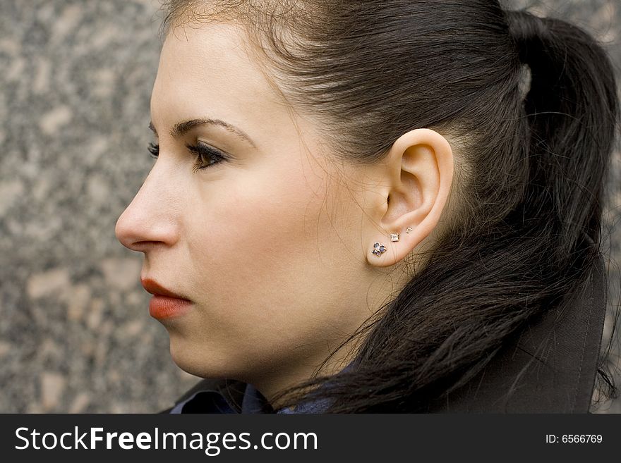 Outdoor portrait of attractive brunet woman