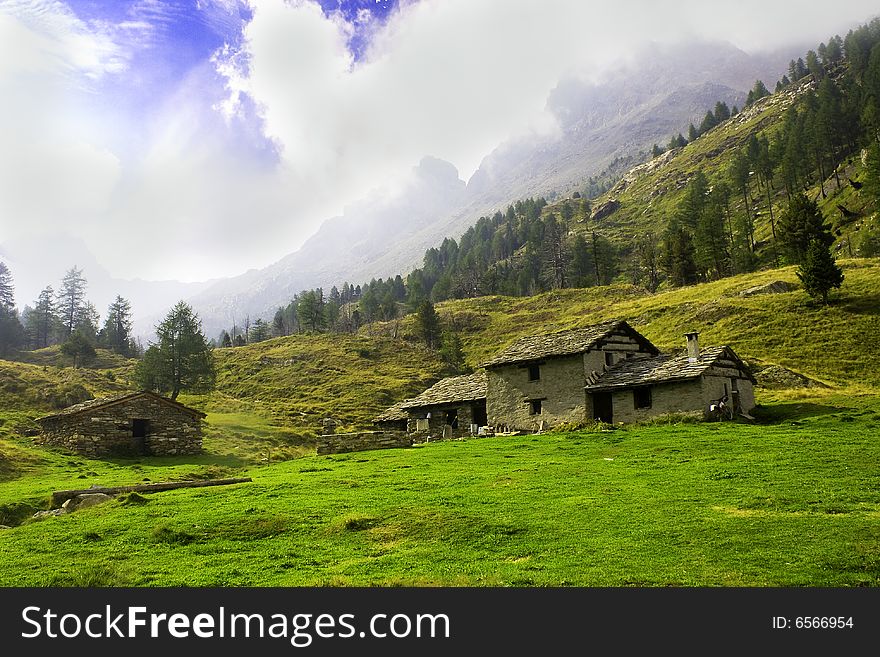 Mountain landscape with stone huts. Mountain landscape with stone huts