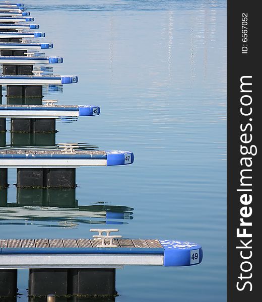 A symmetric sequence of piers with numbered parking lots for boats. A symmetric sequence of piers with numbered parking lots for boats