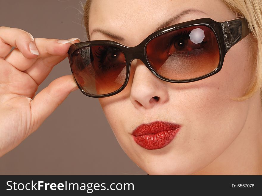 Fifties style beautiful girl in large sunglasses. Fifties style beautiful girl in large sunglasses