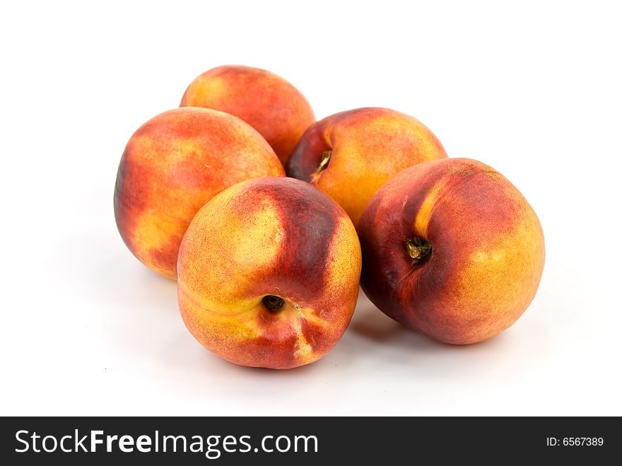 Fresh nectarine on white background.