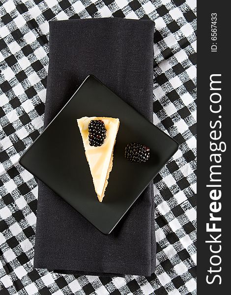 Homemade cheesecake on a black cloth