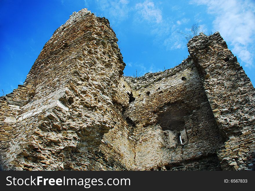 Detail of an ruined tower against blue sky. Detail of an ruined tower against blue sky