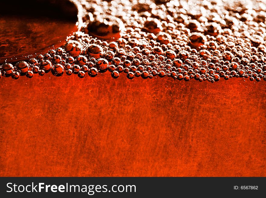 Grunge orange background with water bubbles and old paper