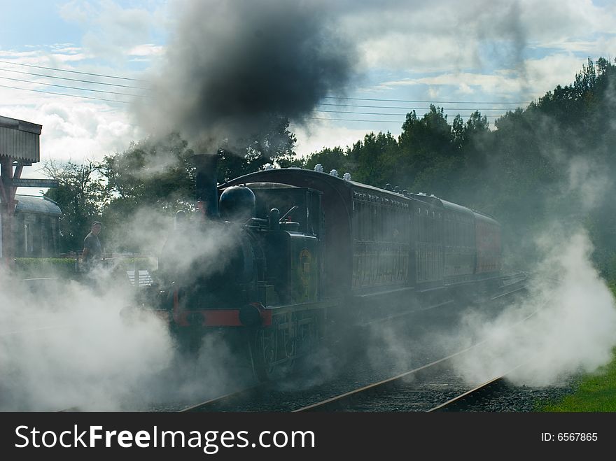 An atmospheric shot of a Steam engine leaving Bodiam Station on the Kent and East Sussex Railway bound for Tenterden in Kent. An atmospheric shot of a Steam engine leaving Bodiam Station on the Kent and East Sussex Railway bound for Tenterden in Kent