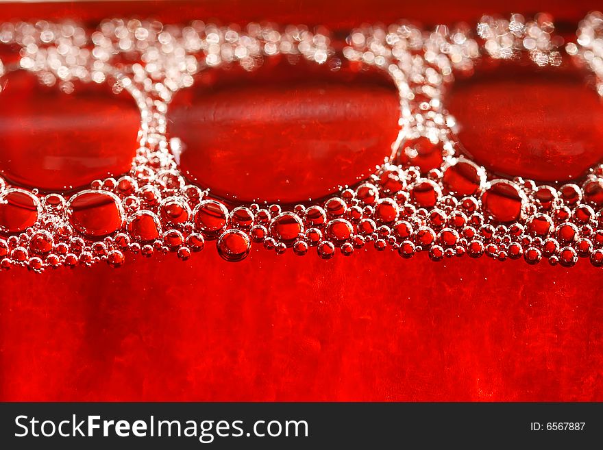 Red Bubbles Water Under Glass Bottle