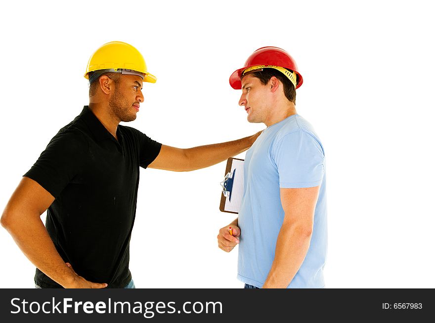 Two construction workers have serious conversation. Two construction workers have serious conversation