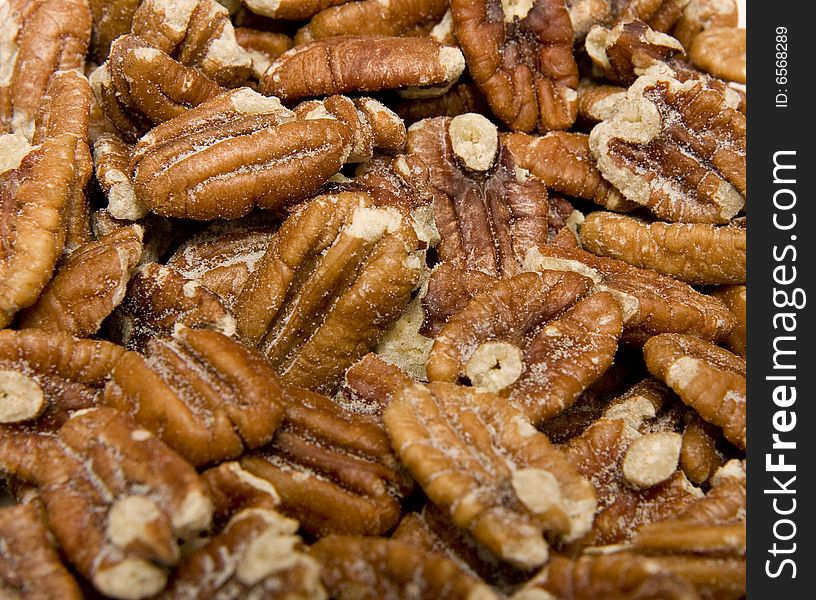 A bunch of hot fresh salty pecans. A bunch of hot fresh salty pecans
