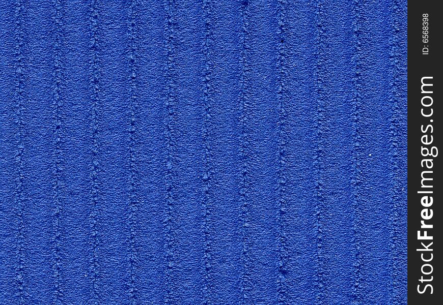 Blue plastic ribbed textured surface of exercise mat