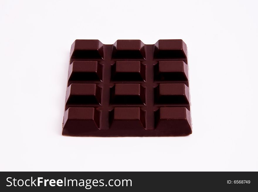 Black chocolate bar on isolated white background