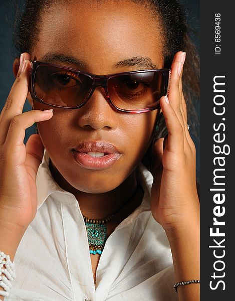 Portrait of young african fashion woman wearing sunglasses. Portrait of young african fashion woman wearing sunglasses