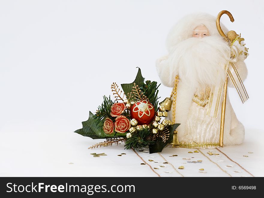 Christmas Santa Claus with golden bell and decorated cone with copy space. Christmas Santa Claus with golden bell and decorated cone with copy space.