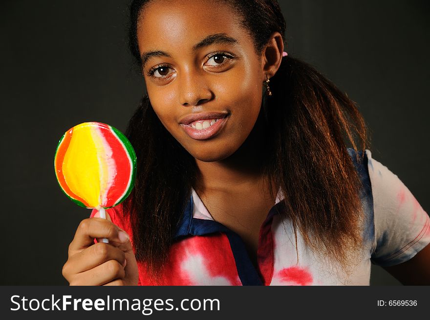 Portrait of cheerful african american child with lollipop. Portrait of cheerful african american child with lollipop