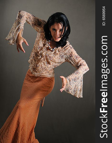 Portrait of young trendy hispanic woman posing in flamenco pose. Portrait of young trendy hispanic woman posing in flamenco pose