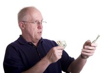 Old Bald Guy Counting Money Stock Photo
