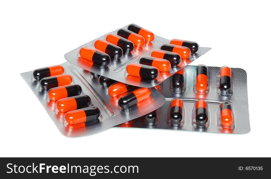 A lot of pills isolated over a white background