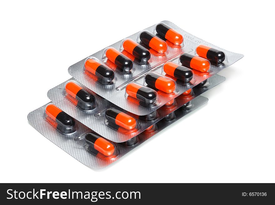 Colored pills isolated over a white background