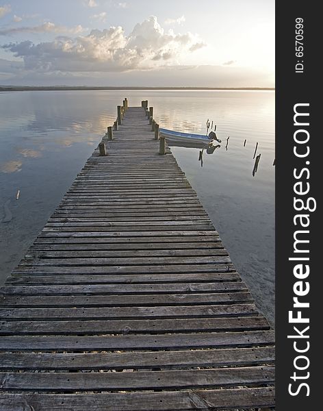 Boat pier at sunset over lake peten, Guatemala