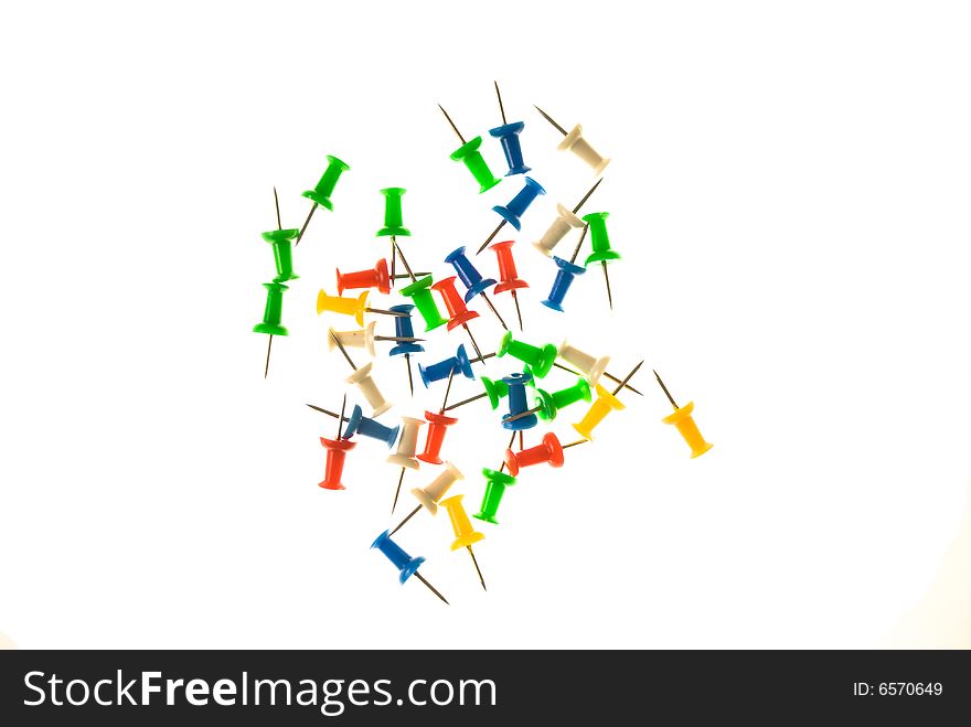 Colorful tacks isolated on the white background