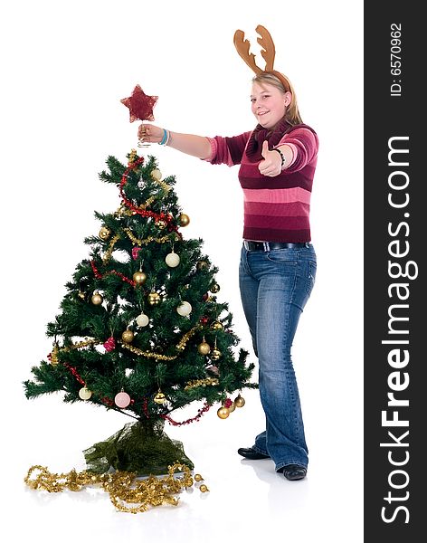 Happy girl decorating the Christmas tree on white background. Happy girl decorating the Christmas tree on white background