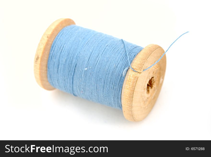 Isolated blue spool on white background. Isolated blue spool on white background