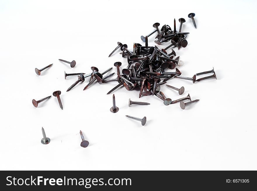 Pile of small nails over white. Pile of small nails over white