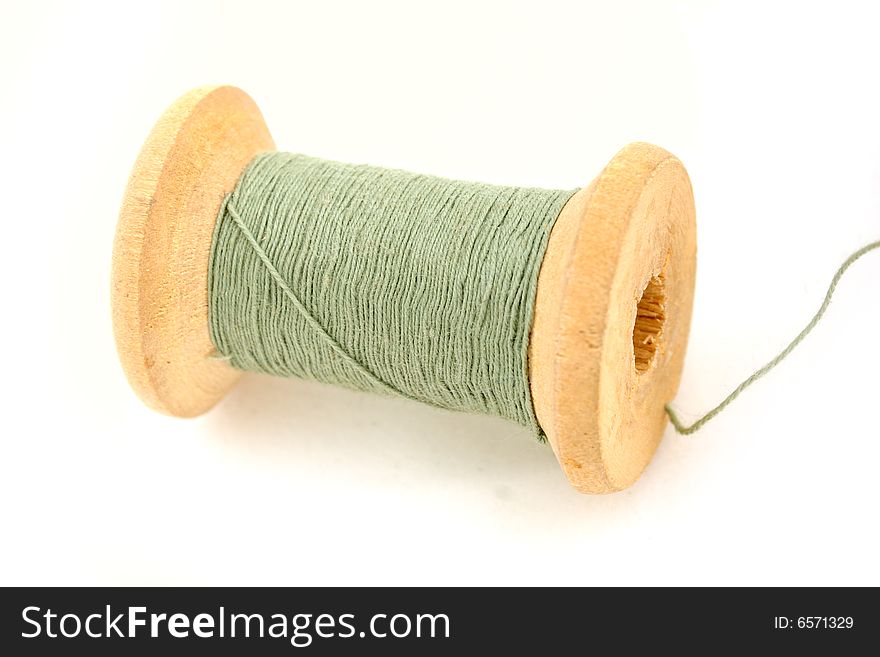 Isolated green spool on white background. Isolated green spool on white background