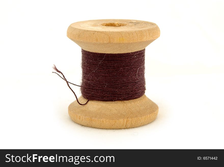 Isolated brown spool on white background. Isolated brown spool on white background