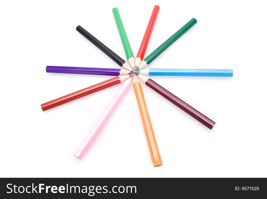 Closeup of a collection of colorful pencils forming a star. Isolated on white. Closeup of a collection of colorful pencils forming a star. Isolated on white.