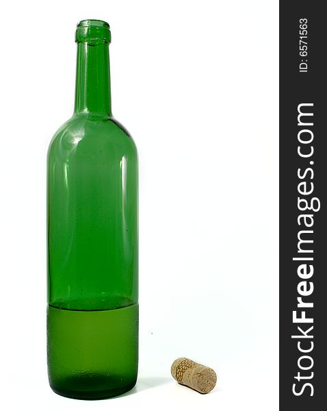 Open bottle from a green glass with a fuse on a white background