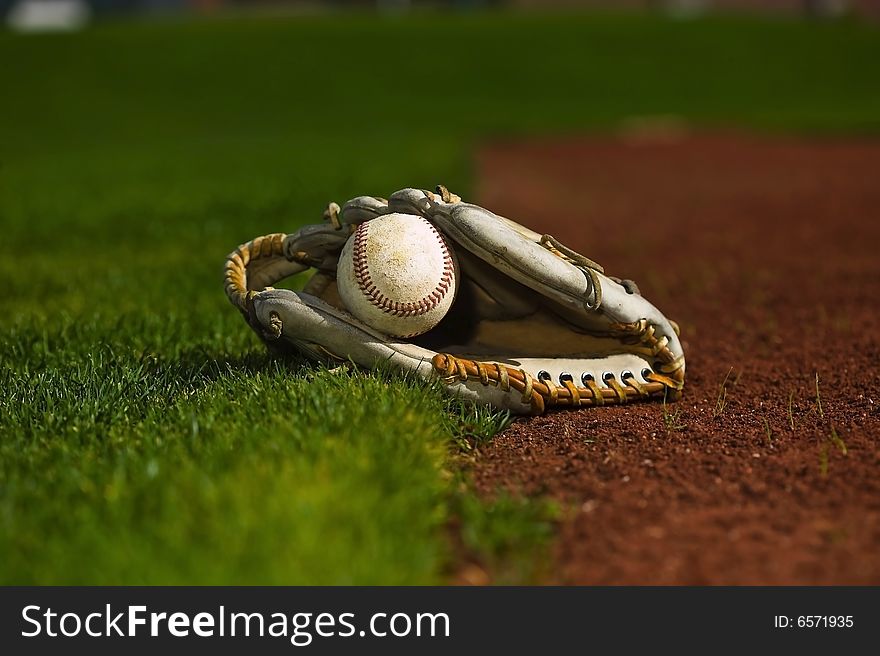 Baseball In Glove On The Field